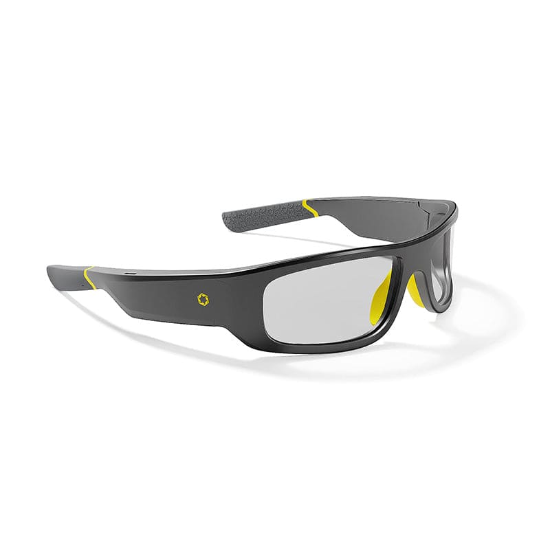 The Lucyd Armor | Slim Photochromic by Lucyd features sleek black and gray ANSI Z87.1 frames with clear lenses, yellow accents on the frame and arms, plus a small yellow logo, offering protection and sporty style.